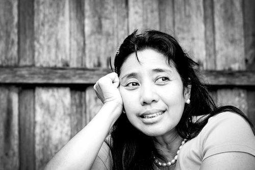 Black and white portrait of a woman gazing into the distance