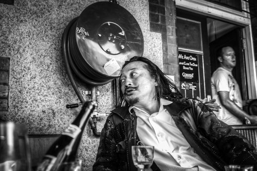 Black and white portrait of Katsuya at a cafe